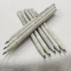 A close-up of a plantable newspaper pencil, showcasing its unique design made from tightly rolled and recycled newspaper, highlighting the printed text visible on the pencil's surface against a plain background.